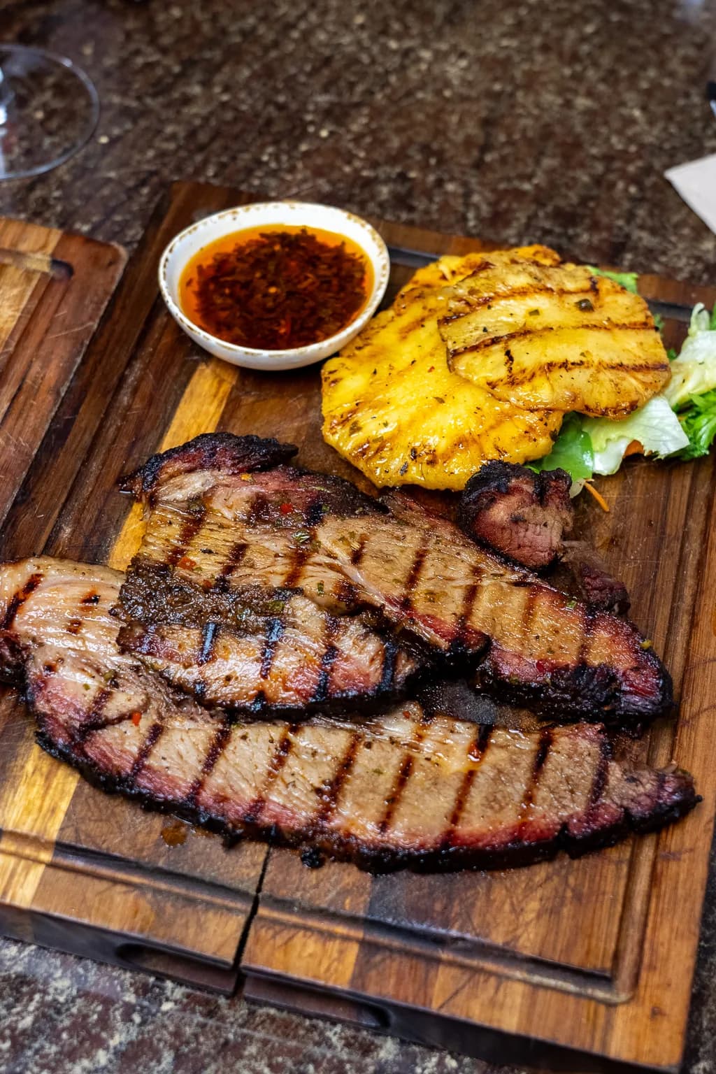 Sliced slow-smoked beef brisket with grilled pineapple and chimichurri at Saltwood, Ferrymead.