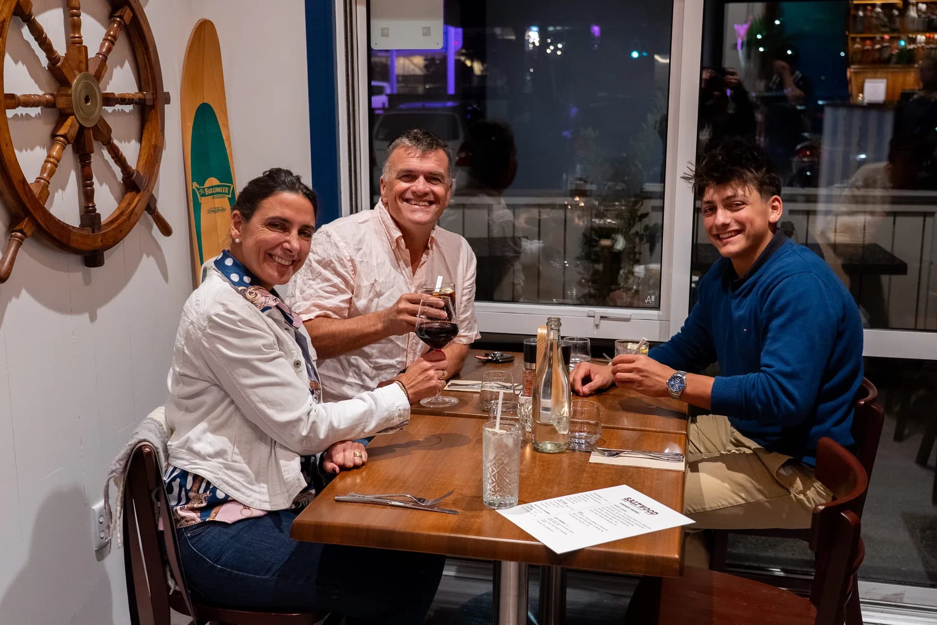 Three guests raising glasses in celebration at Saltwood, Ferrymead.