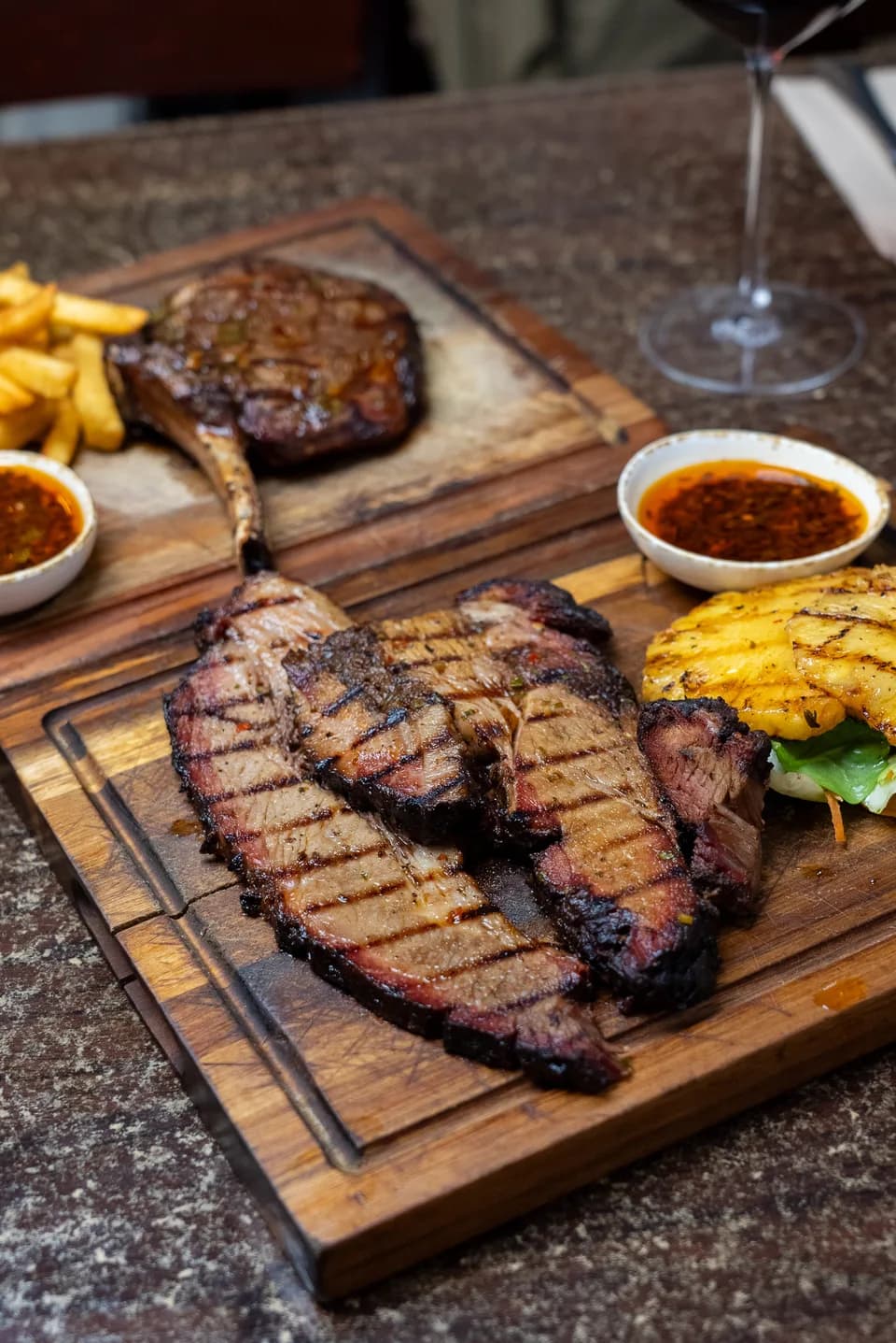 Sliced beef brisket and bone-in ribeye sharing boards at Saltwood, Ferrymead.