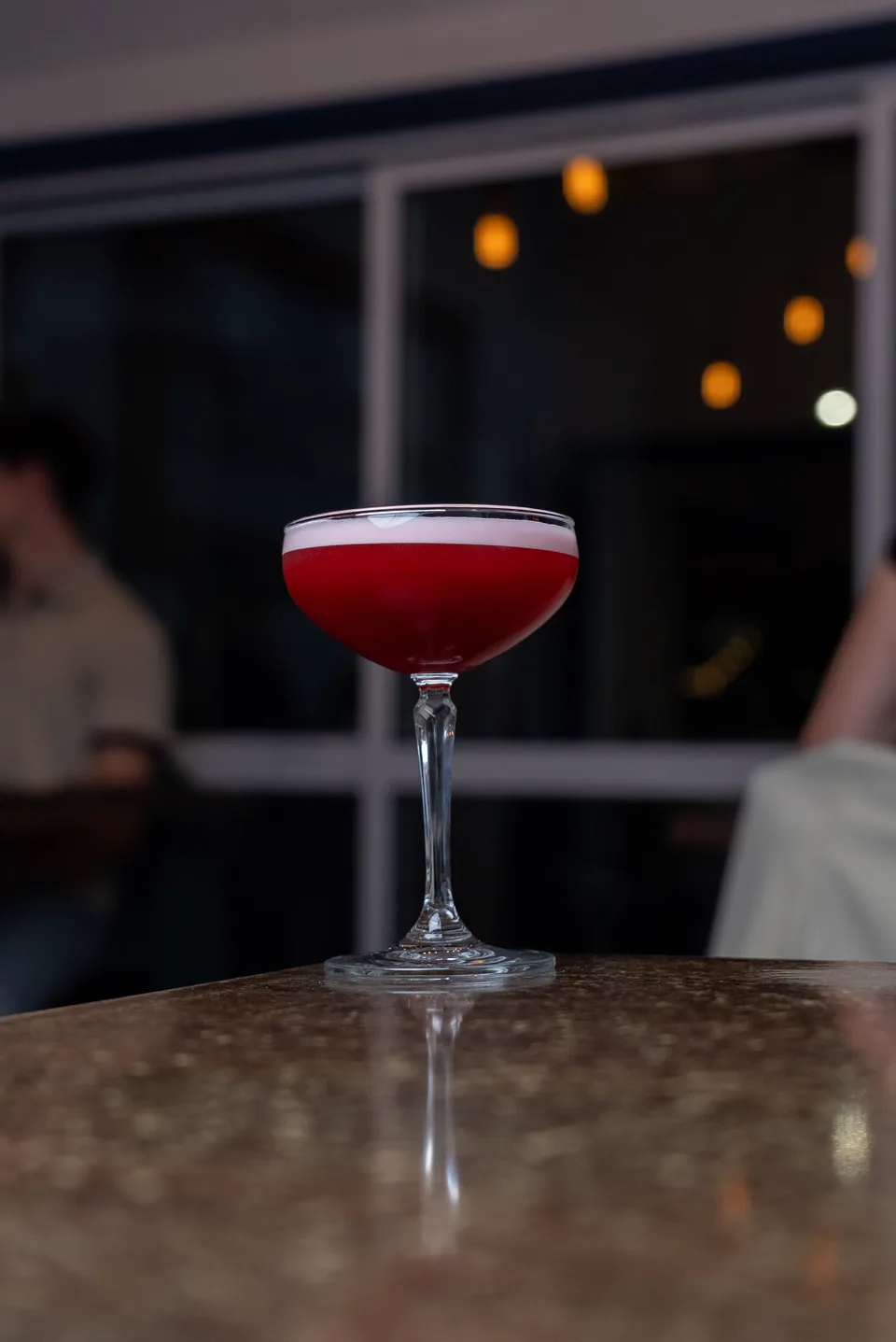 Clover Club cocktail with pink foam and dehydrated lime garnish at Saltwood bar, Ferrymead.