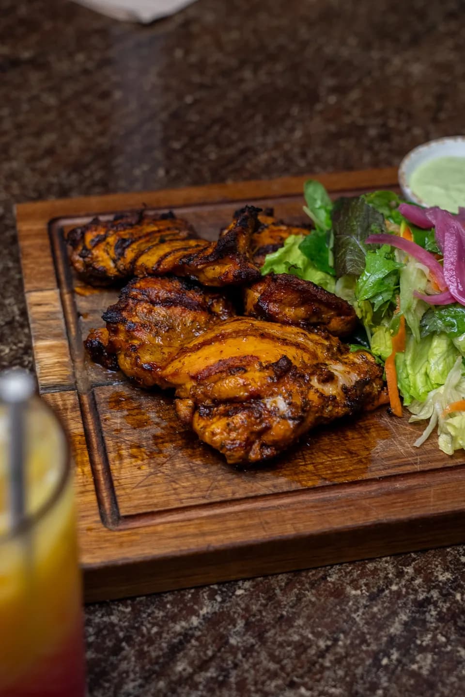 Flame-grilled garlic and spice chicken with fresh salad at Saltwood, Ferrymead.