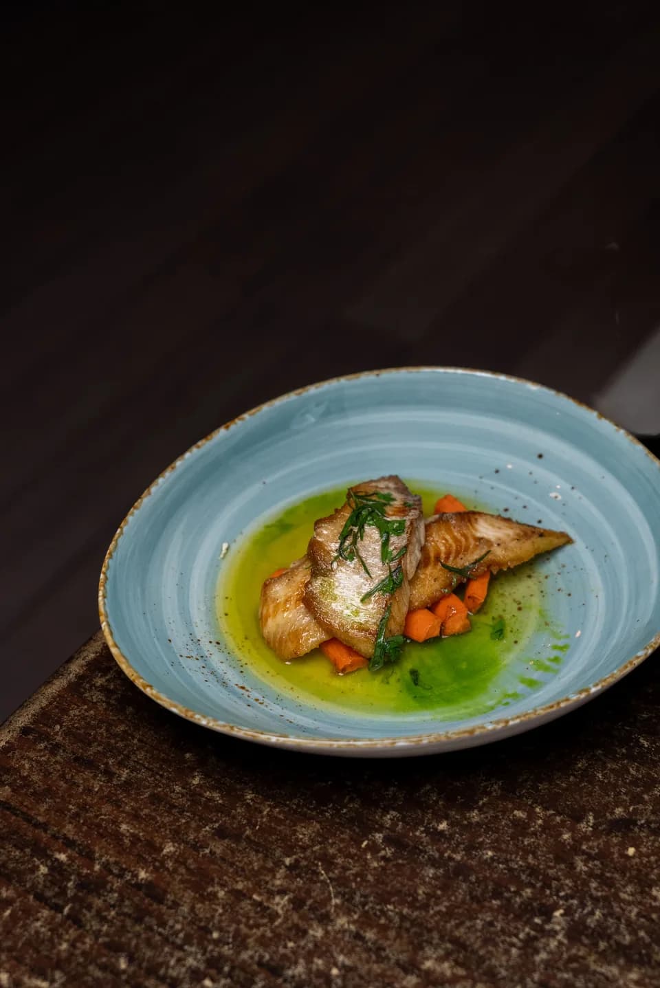Pan-seared market fish with roasted carrots and herb oil at Saltwood, Ferrymead.