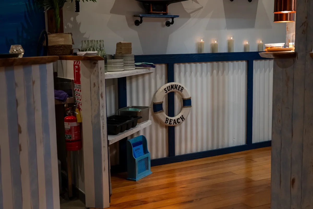 Saltwood service station with nautical decor and Sumner Beach lifebuoy, Ferrymead.