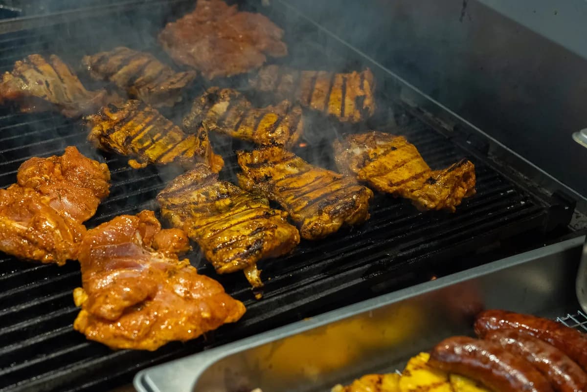 Wood-fired grill with chicken, sausages, and grilled pineapple at Saltwood, Ferrymead.